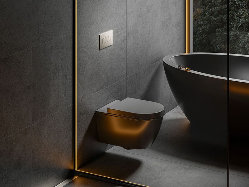 Eine Toilette und eine Badewanne, beides in Schwarz.